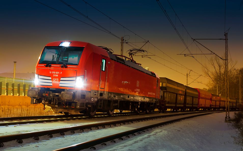 Train with coal wagons at dusk